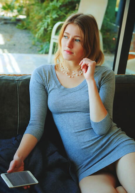 Slim blond young Mila I in fancy skirt exposing small tits and hairy pussy 