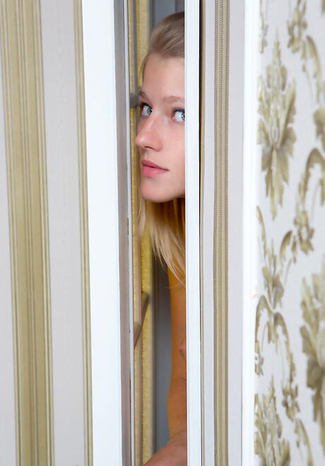 Sylphlike blonde teen Mila I exhibiting small tits and bald pussy 